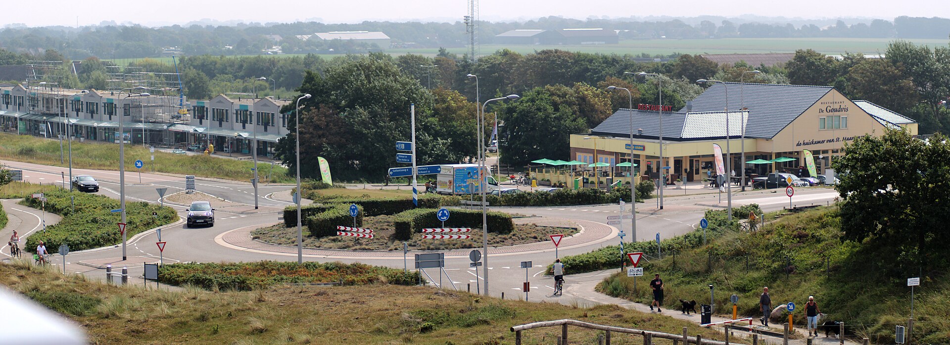 Rural single-lane Dutch roundabout near Petten, North Holland.